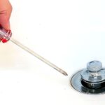 How do you remove a bathtub drain stopper?