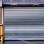 What is the disadvantage of roll-up doors?