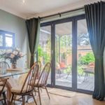 Stylish curtain setup for sliding doors in a bright and cozy home interior