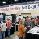 Local homeowners speaking one-on-one with HVAC and renovation contractors at exhibitor booths inside the Exposition Center at the Raleigh fall home show on September 18–20, 2026